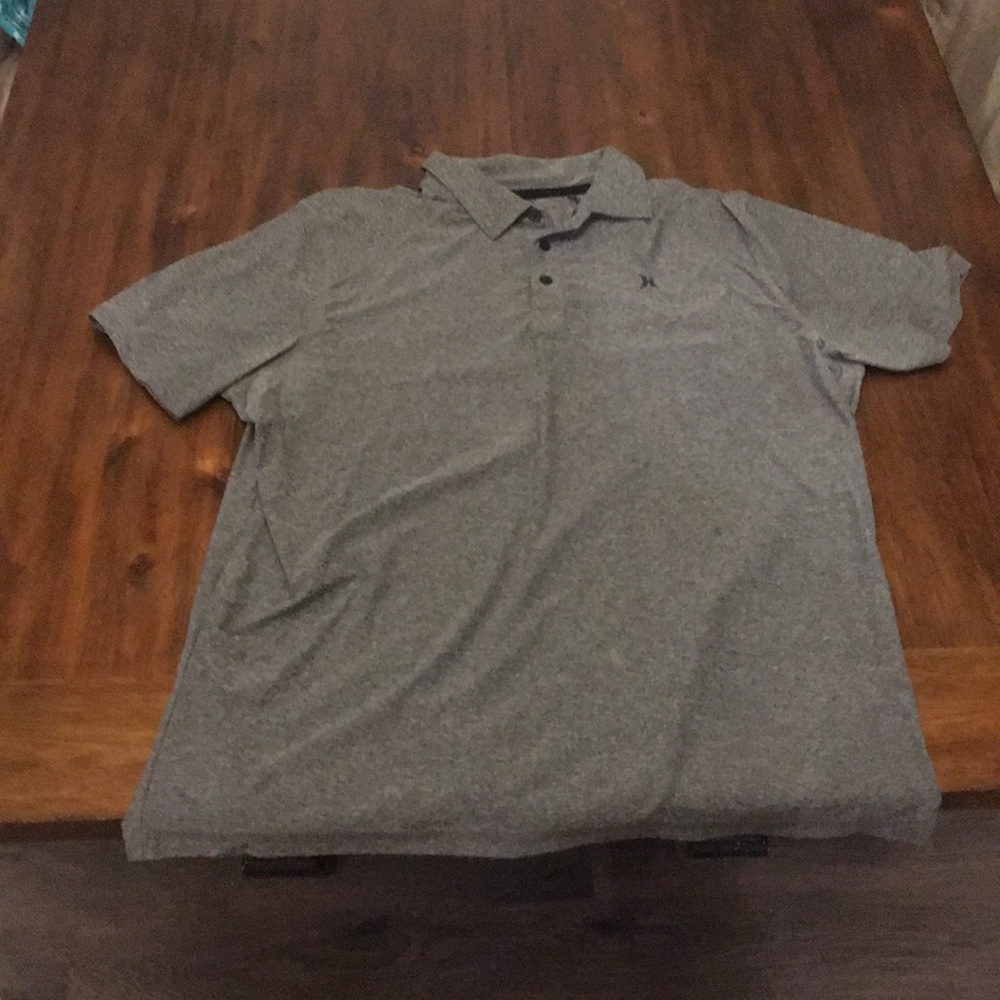 Short sleeved grey collared Hurley shirt.